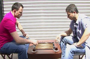 Men enjoying çay and tavla (backgammon) a popular leisure game